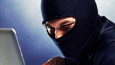 Computer hacker - Male thief stealing data from laptop